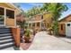 Charming home featuring a patio and landscaped backyard with lush greenery, and a well maintained lawn at 706 Hillcrest St, Orlando, FL 32803