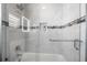 Modern bathtub and shower with niche and unique tile accents at 706 Hillcrest St, Orlando, FL 32803