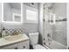 Bathroom features a stylish vanity, and sleek shower with decorative tiling at 706 Hillcrest St, Orlando, FL 32803