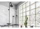 Modern bathroom showcasing double shower head and glass-block window at 706 Hillcrest St, Orlando, FL 32803