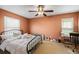Bedroom with ceiling fan, two windows and work area at 706 Hillcrest St, Orlando, FL 32803