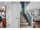Stairway leading to upper level with kitchen access and partial living room view at 706 Hillcrest St, Orlando, FL 32803