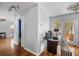 Hallway with hardwood floors, featuring backyard access, and home entry at 706 Hillcrest St, Orlando, FL 32803