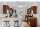 Updated kitchen with stone countertops, breakfast bar, and stainless steel appliances at 706 Hillcrest St, Orlando, FL 32803