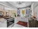Bright, spacious kitchen features white cabinetry, stainless steel appliances, marble countertops, and an elegant design at 706 Hillcrest St, Orlando, FL 32803