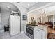 Bright kitchen featuring marble floors, countertops, stainless steel range, and easy access to dining and living areas at 706 Hillcrest St, Orlando, FL 32803