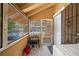 View of screened-in porch, featuring tiled floors, convenient access to the backyard at 706 Hillcrest St, Orlando, FL 32803