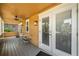 Inviting porch view, featuring french doors, overhead fan, neutral colors, and outdoor seating, perfect for relaxing at 706 Hillcrest St, Orlando, FL 32803