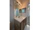 Bathroom featuring a vanity with a mirror and lighting at 7147 Yacht Basin # 132, Orlando, FL 32835