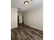 Another bedroom angle shows wood-look floors and a doorway at 7147 Yacht Basin # 132, Orlando, FL 32835