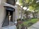 Complex features well-maintained landscaping and covered stairwells at 7147 Yacht Basin # 132, Orlando, FL 32835