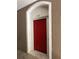Apartment 132 features a red front door with an arched entrance at 7147 Yacht Basin # 132, Orlando, FL 32835