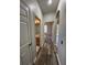 Hallway with wood-look floors leading to the bathroom and bedrooms at 7147 Yacht Basin # 132, Orlando, FL 32835