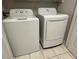 This laundry room includes a GE washer and LG dryer at 7147 Yacht Basin # 132, Orlando, FL 32835