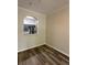 View from the living room into the kitchen with stainless steel appliances at 7147 Yacht Basin # 132, Orlando, FL 32835