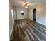 Spacious living room with ceiling fan and attractive wood-look flooring at 7147 Yacht Basin # 132, Orlando, FL 32835