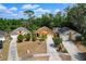 Aerial view showing three homes with landscaping and long driveways at 7951 Chediston Cir, Orlando, FL 32817