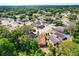 Aerial view of the neighborhood showing the home with surrounding tree coverage at 7951 Chediston Cir, Orlando, FL 32817