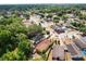 Aerial view of the neighborhood showcasing the house in a residential area with tree coverage at 7951 Chediston Cir, Orlando, FL 32817