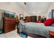 This primary bedroom features an entertainment area and walk in closet for all of your needs at 7951 Chediston Cir, Orlando, FL 32817