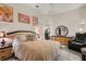This bedroom features neutral colors and a bonus recliner at 7951 Chediston Cir, Orlando, FL 32817