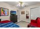 This secondary bedroom features a ceiling fan, closet and bonus seating at 7951 Chediston Cir, Orlando, FL 32817