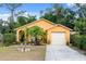 Charming single-story home with vibrant landscaping and a private driveway at 7951 Chediston Cir, Orlando, FL 32817