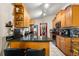 Kitchen featuring stainless steel appliances, wooden cabinets, and tiled floors at 7951 Chediston Cir, Orlando, FL 32817