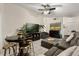 Bright living area with a large gray sectional, pub table, and stylish decor at 7951 Chediston Cir, Orlando, FL 32817