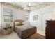 Cozy bedroom with a ceiling fan, carpet, and a large window at 842 Bentley Green Cir, Winter Springs, FL 32708
