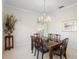 Cozy dining room featuring a chandelier, large table, and ample space for entertaining guests at 842 Bentley Green Cir, Winter Springs, FL 32708