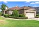 Charming single-story brick home with a two-car garage and well-manicured landscaping at 842 Bentley Green Cir, Winter Springs, FL 32708