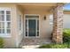 Elegant front entrance featuring decorative glass and brick columns, offering a warm welcome at 842 Bentley Green Cir, Winter Springs, FL 32708