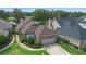 Charming single-story home featuring brick accents, manicured landscaping, and a two-car garage, all near a serene lake at 842 Bentley Green Cir, Winter Springs, FL 32708