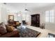 Spacious living room featuring a plush rug, fireplace, and comfortable seating arrangement at 842 Bentley Green Cir, Winter Springs, FL 32708