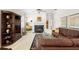 Comfortable living room with fireplace, leather furniture, and stylish decor at 842 Bentley Green Cir, Winter Springs, FL 32708
