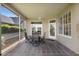 The screened lanai features a dining table, four chairs, and sliding glass doors, perfect for outdoor entertaining at 842 Bentley Green Cir, Winter Springs, FL 32708