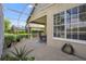 Spacious screened-in patio with view of lush landscaping. Perfect for entertaining at 842 Bentley Green Cir, Winter Springs, FL 32708