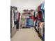 Walk-in closet with hanging racks, shelves and shoe storage at 842 Bentley Green Cir, Winter Springs, FL 32708