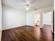 This bedroom features a ceiling fan, hardwood floors, and ensuite bathroom at 8818 Villa View Cir # 304, Orlando, FL 32821