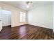 Bright bedroom with hardwood floors, ceiling fan and a walk-in closet at 8818 Villa View Cir # 304, Orlando, FL 32821