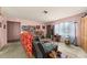 Bright living room with neutral walls, comfortable seating, and multiple windows offering ample natural light at 99 Rainbow Dr. # 4, Haines City, FL 33844