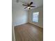 Sunlit bedroom with a modern ceiling fan, and stylish wood-look floors at 1007 Colyer St, Orlando, FL 32805