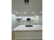 Kitchen featuring a island with quartz countertops, white cabinets, and stainless steel appliances at 1007 Colyer St, Orlando, FL 32805