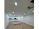 Spacious living room featuring wood flooring, ceiling fan, and recessed lighting at 1007 Colyer St, Orlando, FL 32805