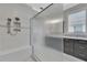 Bright bathroom featuring a frameless walk-in shower, sleek fixtures, and a stylish vanity at 10742 Belle Maisons Dr, Orlando, FL 32832