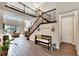 Grand foyer with soaring ceilings, dark wood staircase, and elegant decor at 10742 Belle Maisons Dr, Orlando, FL 32832