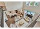 High angle showcases open floor plan with a seamless blend of living, kitchen, and dining spaces at 10742 Belle Maisons Dr, Orlando, FL 32832