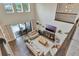 Overhead shot showing open living area, tall ceilings, outdoor access and upper level railing at 10742 Belle Maisons Dr, Orlando, FL 32832