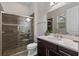 Bathroom with a modern glass shower, stylish tile, and a vanity with a white quartz countertop at 10819 Savona Way, Orlando, FL 32827